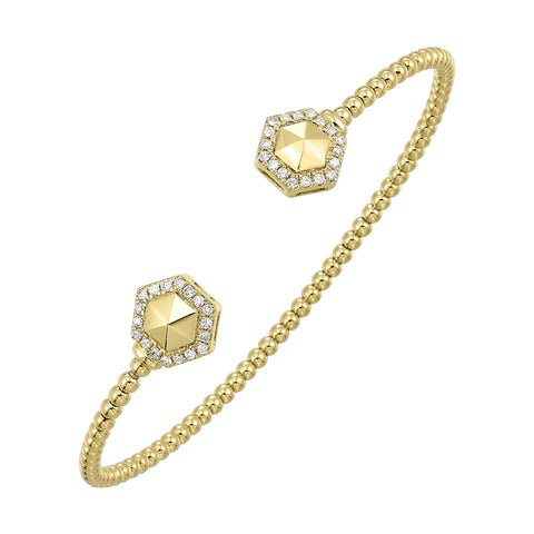 This yellow gold bangle, adorned with two diamond-framed hexagons, emanates simple brilliance. Perfect for any attire, it offers a graceful blend of style and elegance.